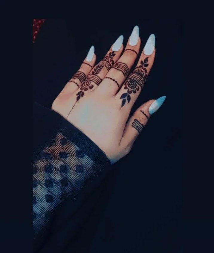 Delicate henna design with styled nails